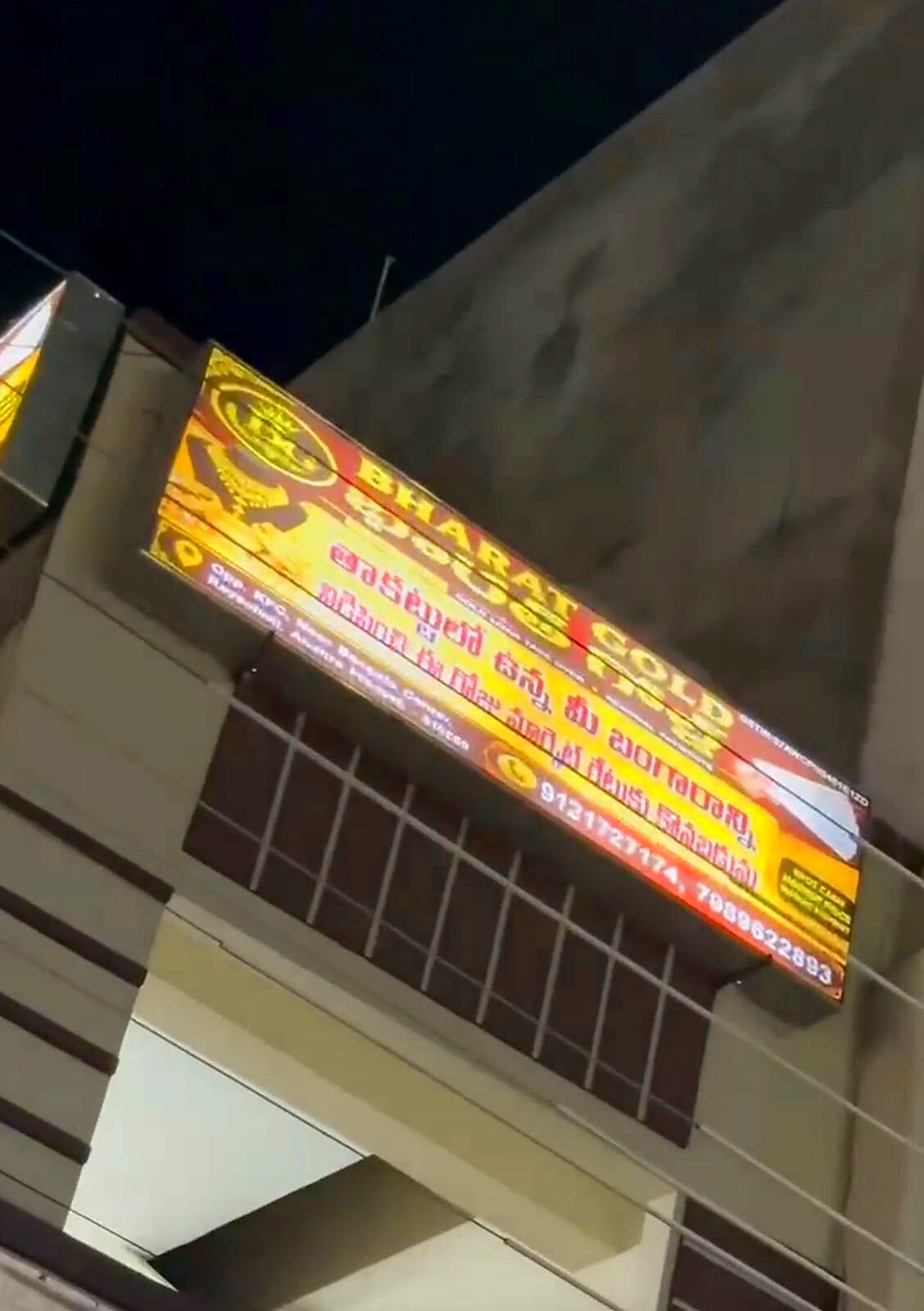 Bharat Gold signboard lit up at night in Rayachoti